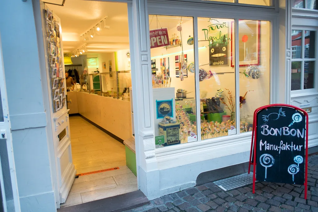 Storefront of the Bonbon Manufaktur candy shop in Heidelberg's old town.