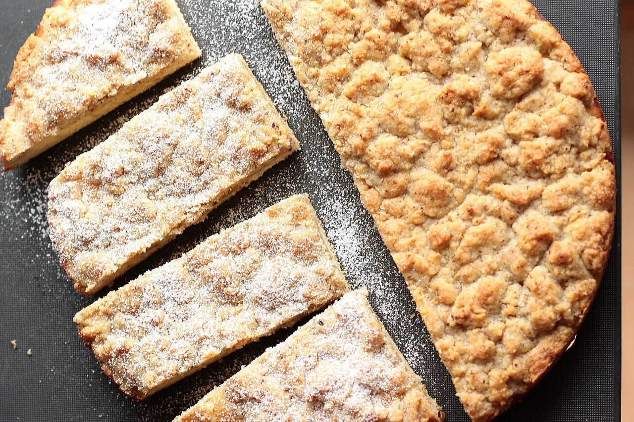 Hazelnut Streuselkuchen cut into slices.