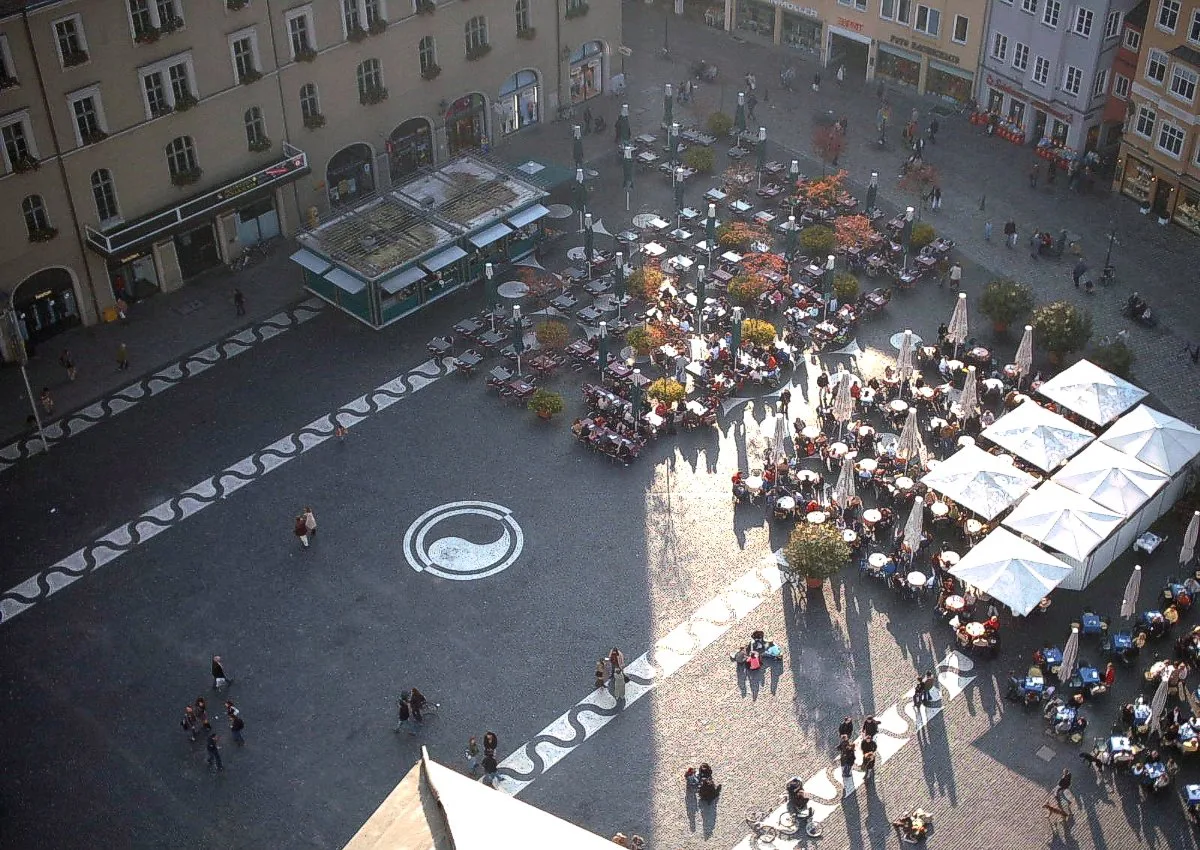 Café tables on Rathausplatz seen from the Perlachturm, Augsburg.