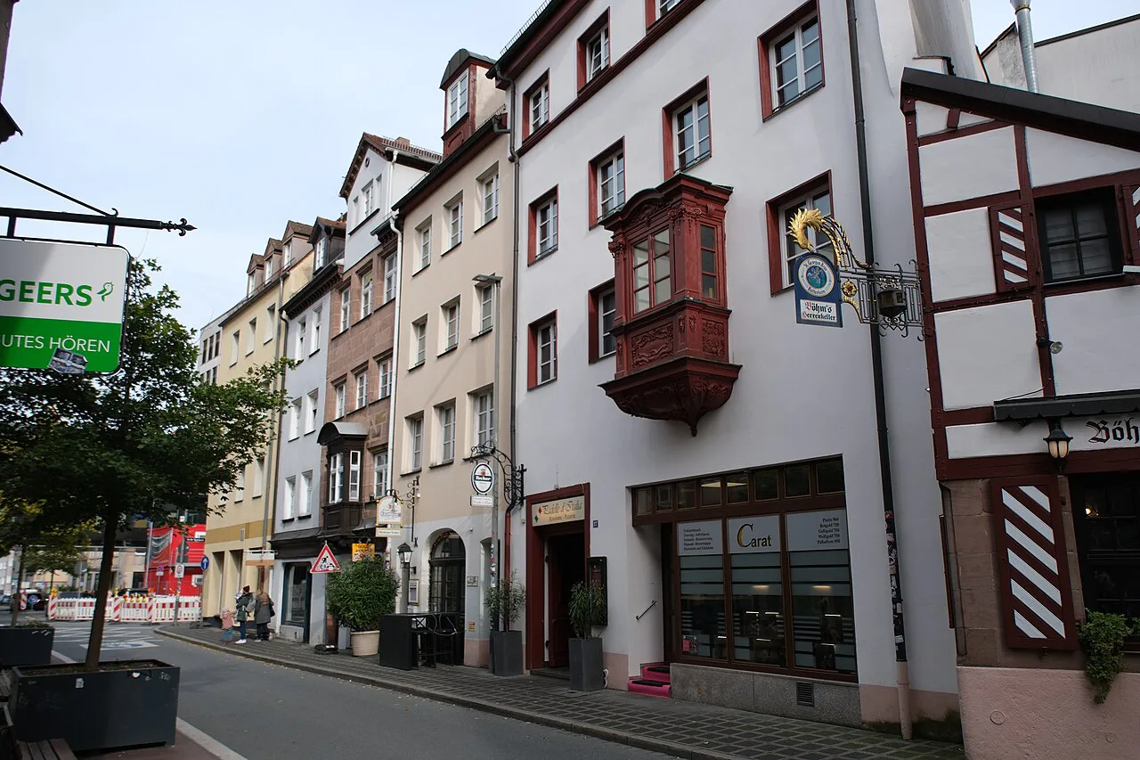 Theatergasse with a half-timbered oriel house in Nuremberg's old town.