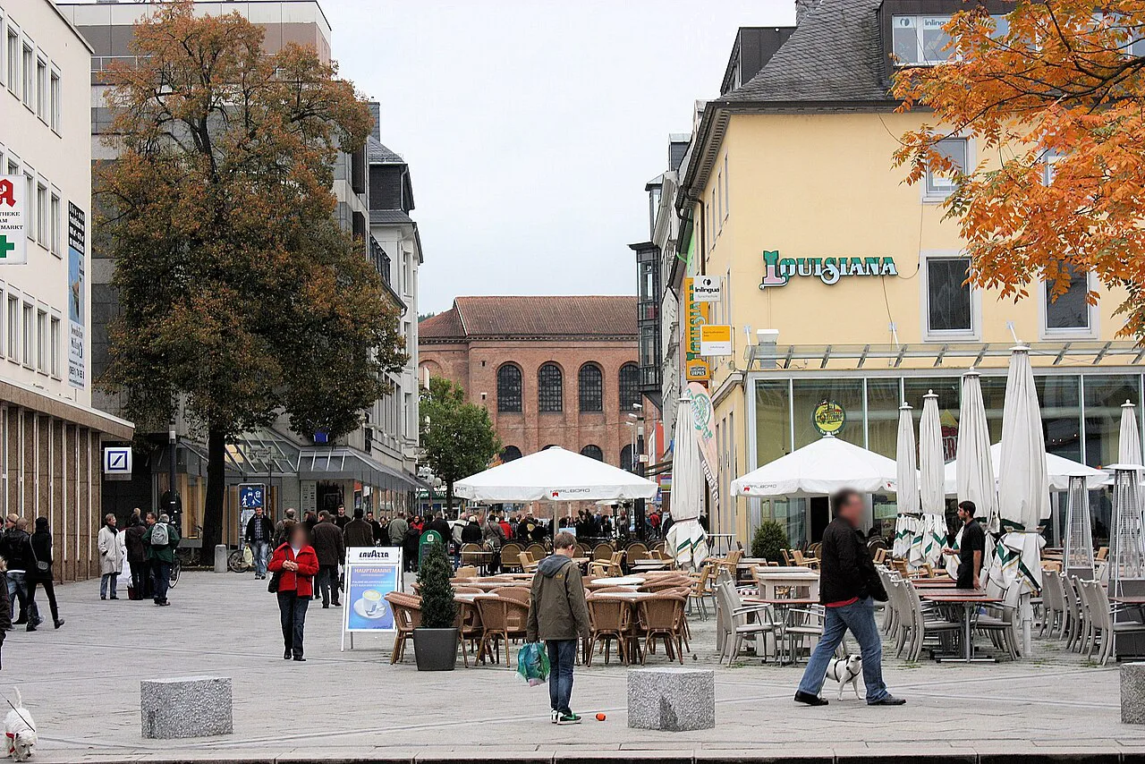 Café terraces with umbrellas on the Kornmarkt, Trier.