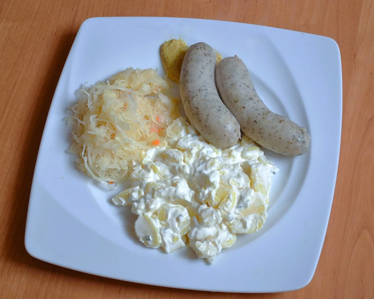 Weisswurst with sauerkraut and mashed potatoes.