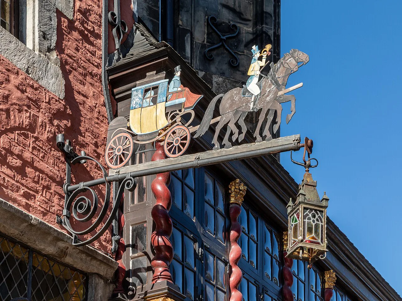 The ornate stagecoach sign of the Ratskeller, Aachen.
