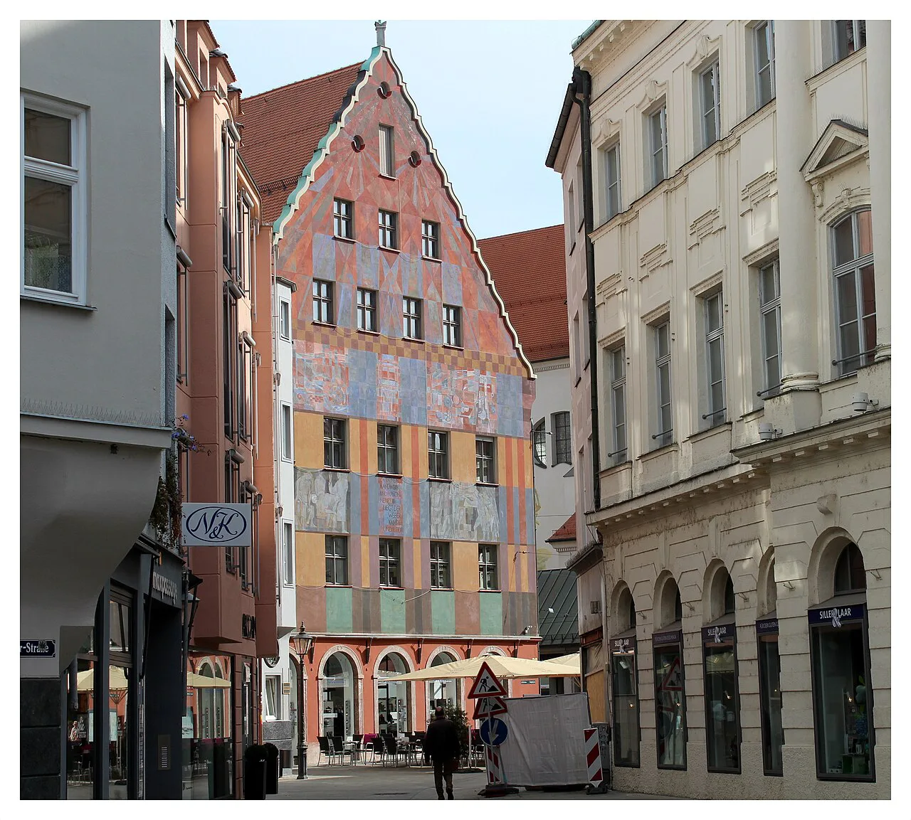 Colorful historic facades on a street in Augsburg's old town.