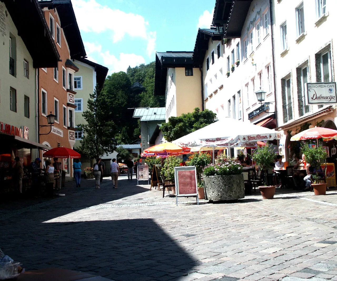 Café umbrellas on a pedestrian street in Berchtesgaden's town center.