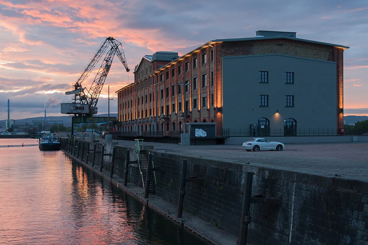 The former wine warehouse on the south pier of the Zollhafen port at sunset, Mainz.