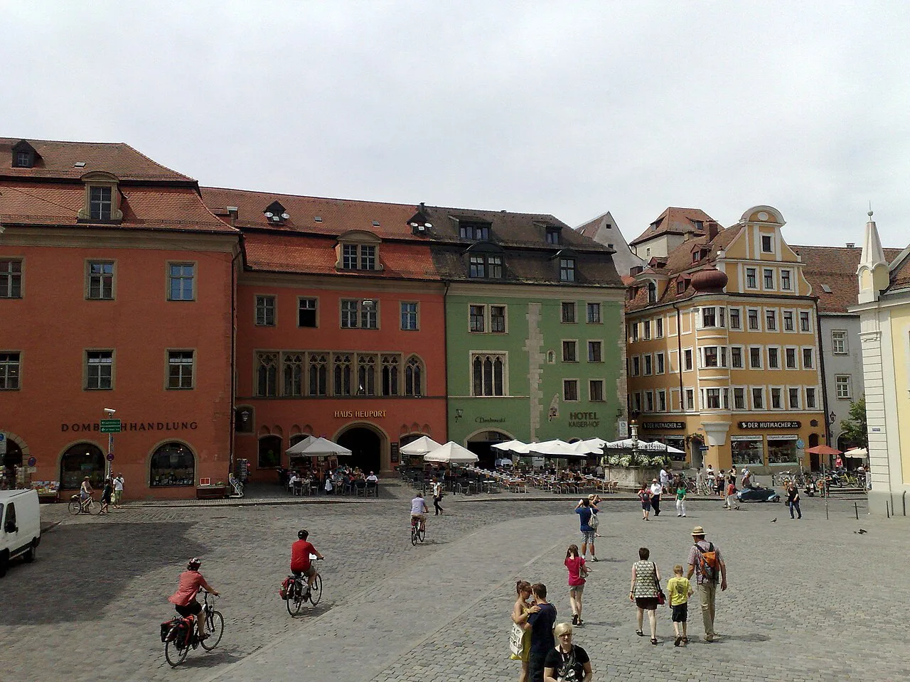 Café tables on an old town square in Regensburg.