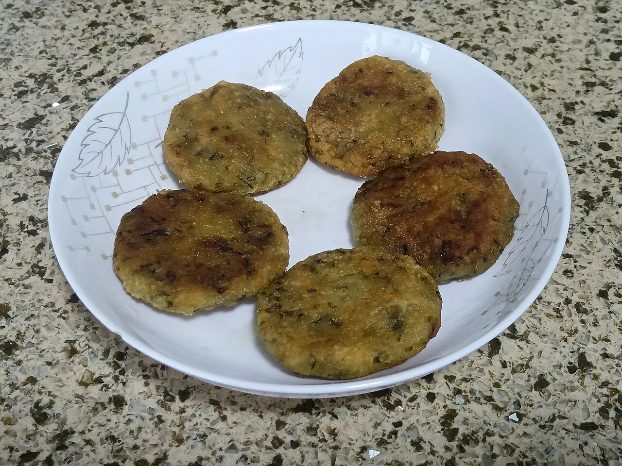 Wild garlic pancakes on a plate.